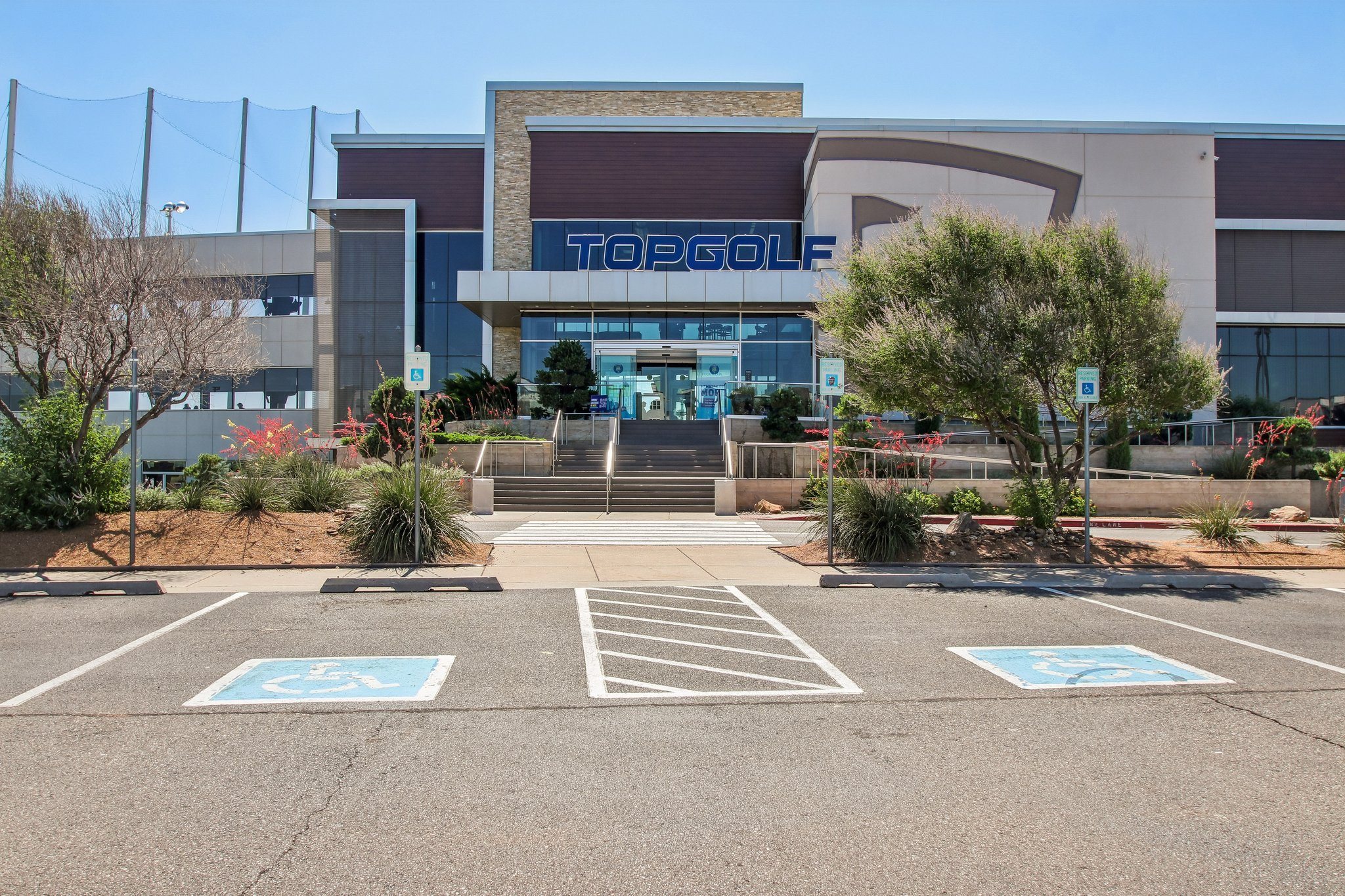 A parking lot in front of a Toggolf store.